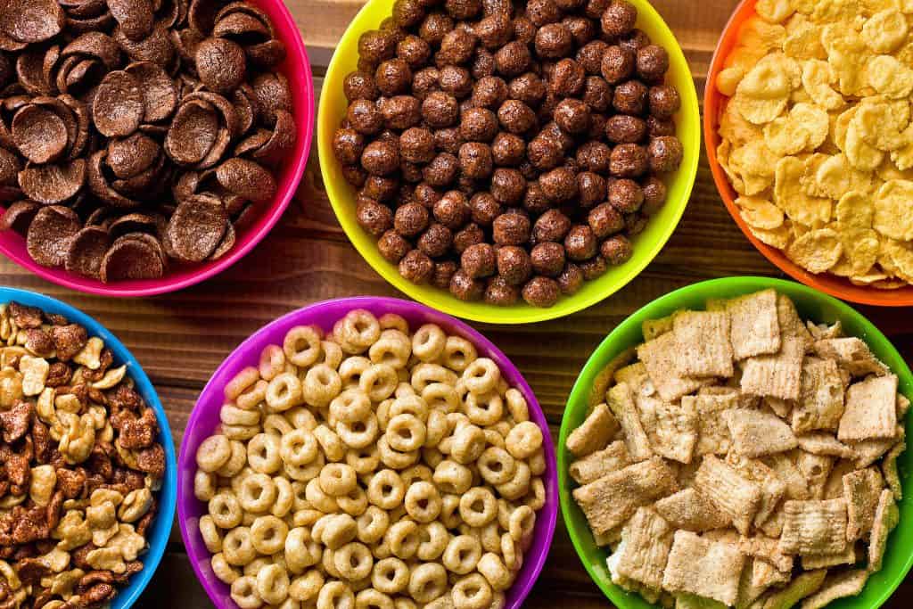 Assorted breakfast cereals in colorful bowls – healthy snack options from Ingrevia.